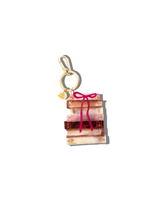 book stack with bow bag charm